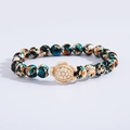 Detailed view of colorful turquoise beads with a white sea turtle charm on a beaded bracelet - Blue Orange White Spotted White Turtle Bracelet
