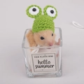 Detail of hand-knitted green frog hat on a hamster inside a glass jar for pets - Frog Hat