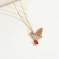 Golden necklace with crystal flying bird pendant and red gemstone in a 45-degree view - Bird