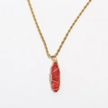 Macro view of red hexagonal crystal pendant wrapped in gold wire with twist chain - Red Textured