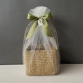 Detail of seagrass gift basket with white mesh wrap, green ribbon and thank you tag - Moss Green Full Wrap Snow Mesh