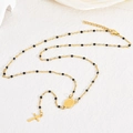 Detail of 18K gold plated cross necklace with black beads and religious coin pendant - Black