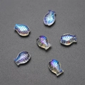 Close-up of fish-shaped iridescent blue crystal beads for DIY jewelry making and crafts - Imported Colorful