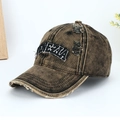 Close-up of distressed vintage cotton baseball cap with Venezia embroidery and ripped details - Khaki