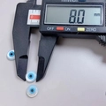 8mm light blue mother of pearl evil eye loose bead shown with digital caliper measurement - 8mm