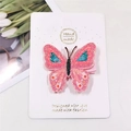 Detailed view of handmade pink glitter butterfly hair clip with colorful sequins on card - Pink Purple Butterfly