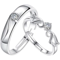 Macro shot of silver plated adjustable couple rings with clear round gemstones - Angel Wings