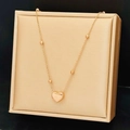 Elegante collar de acero de titanio oro rosa con colgante de corazón y cuentas de oro - Oro rosa