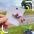 Detail of marble pattern resin cat hair clip on brand card with outdoor light - Camo Blue Pink