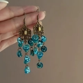 Detail of vintage bohemian tassel earrings with bronze metal and teal beads - Lake Blue Vintage Flower (16#)