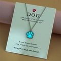 Luminous dog paw pendant necklace on display card with glowing blue pet footprint charm - Sky Blue