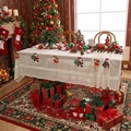 Lace Christmas tablecloth with Santa Claus embroidery on a festive wooden dining table - Santa Claus