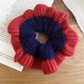 Close-up of contrast red and blue knitted scrunchie texture on a wooden desk - Hair Tie / Red & Blue