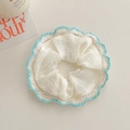 Detail of white scrunchie with blue crochet lace trim and pleated texture fabric - White Lace Style / White