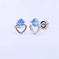 Detail view of heart-shaped silver earrings with sparkling blue crystal inlay - Single Blue Zircon Hollow Heart