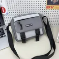 Grey and white canvas crossbody bag with PINBO BAG logo and adjustable nylon strap - Gray