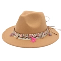 Camel felt fedora hat with ethnic shell decor and colorful tassels on white background - Camel