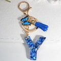 Royal blue resin letter Y keychain with gold foil, blue tassel and butterfly charm - Letter Y