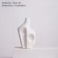 Modern white ceramic abstract vase with geometric hollow center and textured finish - Rockery Vase Ornament-101