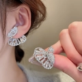 Elegant silver butterfly stud earrings with sparkling crystals shown on a female model - 98# Silver Butterfly