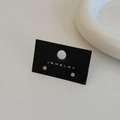 Macro shot of minimalist pastel pink bead stud earrings on a premium black jewelry card - Milk Tea Color Gold Plated