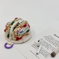 Colorful knitted earphone storage pouch with purple clip and white zipper detail - Multi-colored Dots