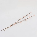 Macro shot of artificial light pink berries on brown branches for DIY spring decor - Pink