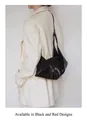 Minimalist black oil wax leather crescent bag with geometric fold design and shoulder strap - Black Style