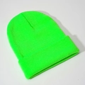 Detailed view of neon green knitted beanie featuring ribbed texture and cuffed design - Fluorescent Green