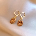Champagne zircon gold hoop earrings displayed on soft silk background - Champagne Round Flower Style
