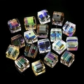 Macro shot of faceted cube crystal glass beads with aurora AB finish for DIY jewelry - Multicolor