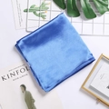 Detail shot of solid blue satin silk scarf showing smooth texture and glossy finish - Blue