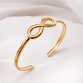 Elegant gold-plated stainless steel open bangle featuring a polished infinity symbol design - Infinity / Gold