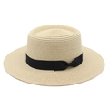 Close-up of a wide-brim boater hat featuring fine straw weaving and a black ribbon bow - M (56-58cm) / Beige