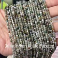 Faceted 3mm Indian Agate beads featuring natural green and grey tones on hand - Indian Agate 3mm