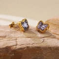 Detailed close-up of golden butterfly earring with purple zircon on natural stone - Purple Butterfly Stud Earrings (BD510-purple)