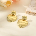 Detailed close-up of 18k gold-plated heart earrings with vertical striped texture and gloss - Gold Style (ZYN-DME513G)