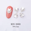 Macro shot of silver heart nail charms with central pearl and butterfly detail 8*9.5mm - Silver Butterfly Pearl Heart (8888)