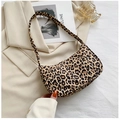 Close-up of leopard print shoulder bag with crescent shape and smooth zipper detail - 23*13*7 / Leopard Print