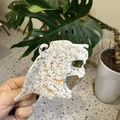 Detailed view of leopard head hair claw clip made of white acetate with gold accents - White Bubble Leopard