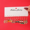 Detail of Christmas earring set featuring gingerbread man and bell on red card - Gingerbread Bell Styles (E0605-1/6 Pairs)