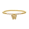 Elegant gold beads and white pearl bracelet with a sparkling butterfly charm on white background - Sweet Micro-Pave Butterfly Gold Beaded Bracelet
