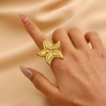 Golden starfish statement ring with textured design on elegant champagne silk background - Gold Starfish Shape (7045)