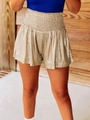 Detail of shimmering gold metallic high waist shorts with elastic pleated waistband - Champagne Gold