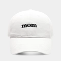 Detailed close-up of 'mom' embroidery on a premium white cotton twill baseball cap - Adjustable / White