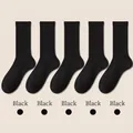 Five pairs of black rib-knit mid-calf cotton socks with elastic vertical stripe design - One Size / Black