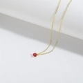 Minimalist gold necklace featuring a red round gemstone pendant with four-prong setting - Red (Gold Chain)