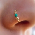 Minimalist gold S-shaped nose ring clip with turquoise bead and gold accents on model - NR001-Turquoise Bead Woven Nose Ring / Gold