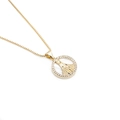 Close-up of gold-plated Virgin Mary pendant with sparkling white cubic zirconia inlay - 0115 Round Zircon Mary