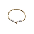 Detail of gold beads and white pearls bracelet with a colorful zircon letter P charm - Letter P